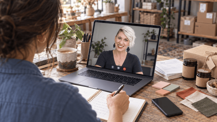Small business owner on a video consultation call at her desk, representing the support Danielle LeBaron and Co. provides